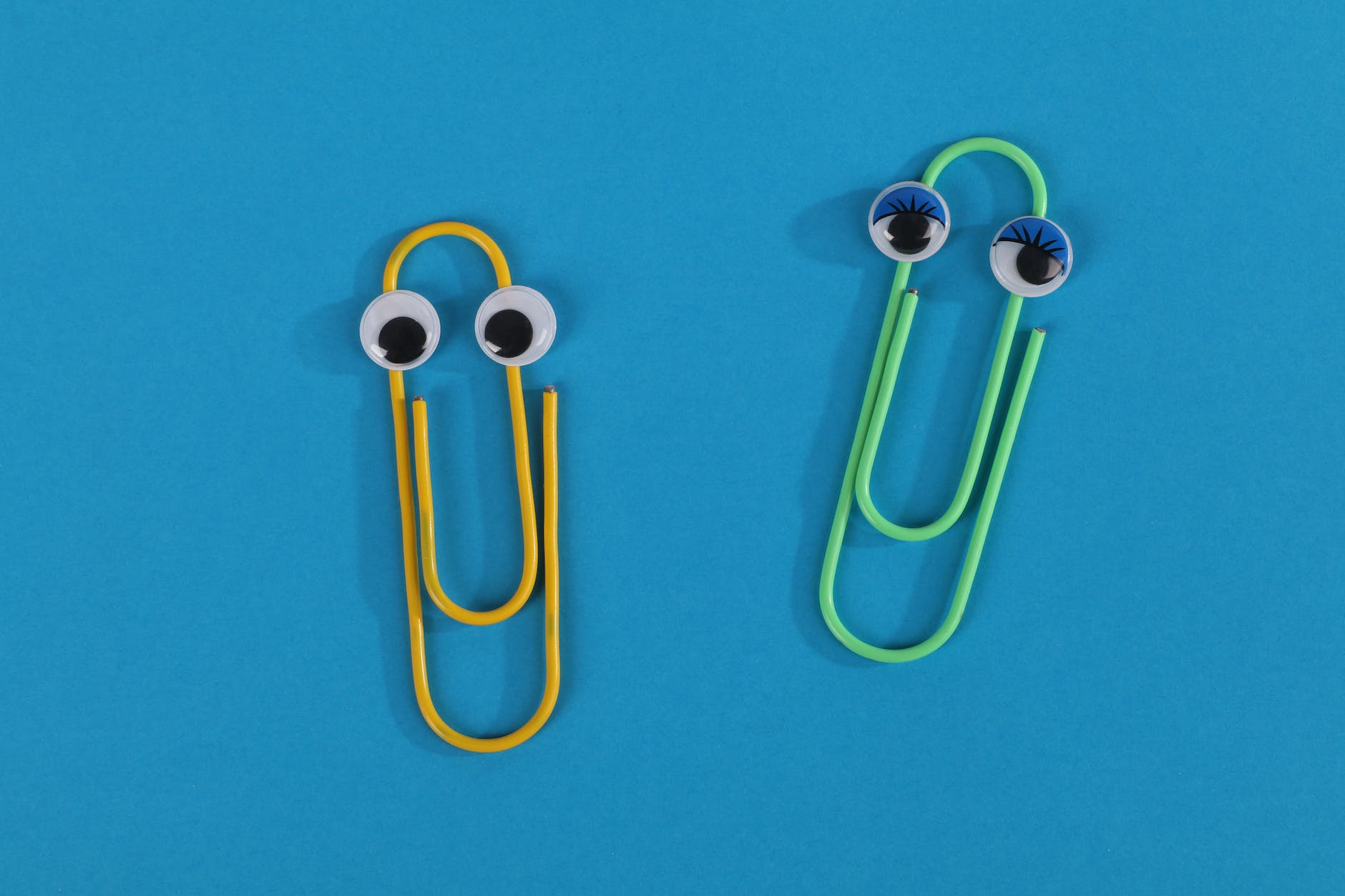 yellow paper clip on blue background